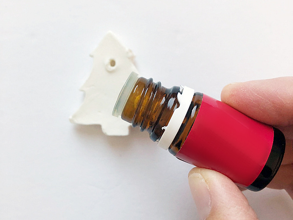 Adding essential oil to the back of a DIY Clay Ornament