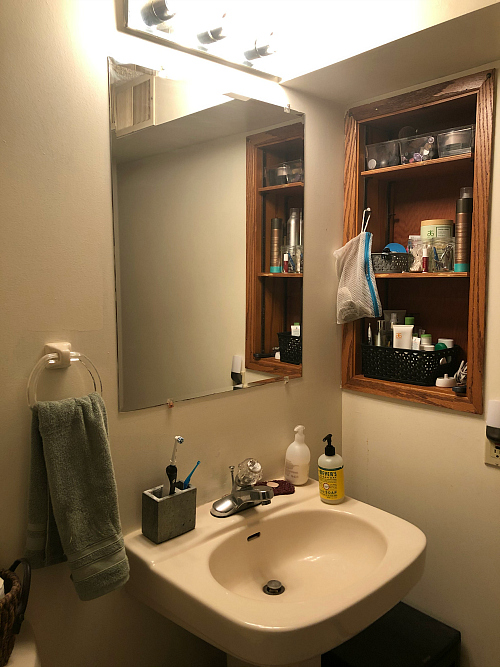 Outdated Inlaid Cubby in wall of bathroom prior to $100 Room Challenge