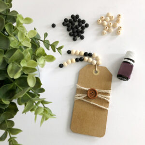 DIY Diffuser Bookmark with some loose beads and a bottle of essential oil