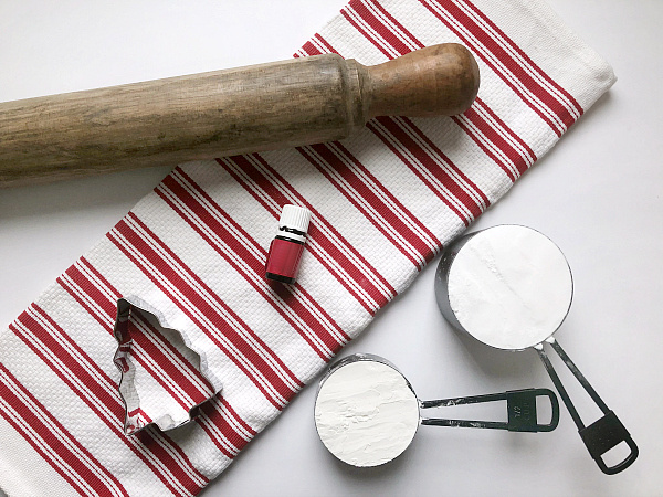 Items needed to make scented clay ornaments: baking soda, corn starch, essential oil