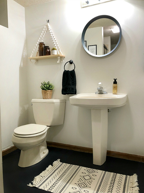 $100 Boho Bathroom Makeover. Freshly painted walls. Painted floor. New Mirror and shelf.