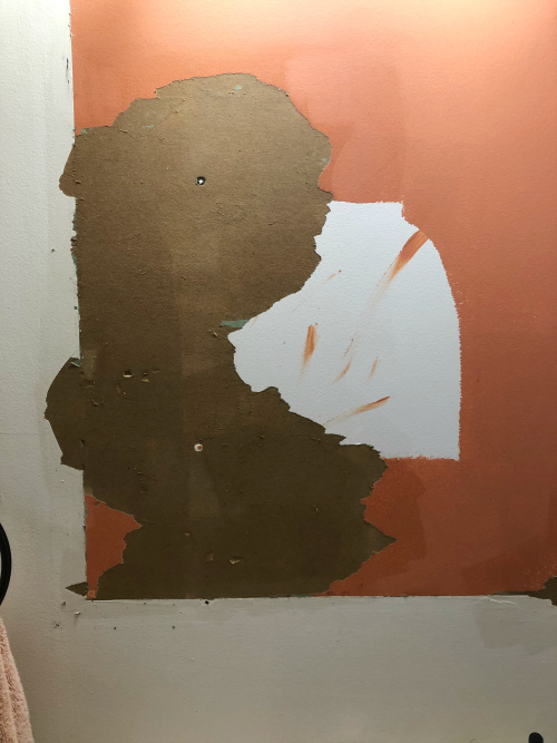 Damaged drywall after removing vanity mirror