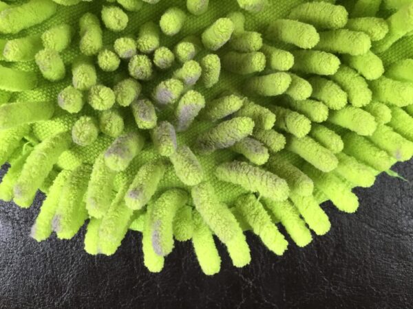 Microfiber Dusting Mitt with dust on it