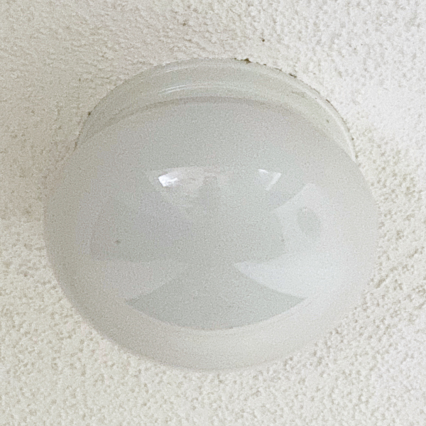 Current outdated light fixture in entry