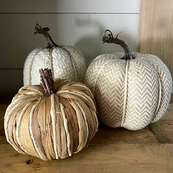 Neutral Textured Pumpkins used as fall decor for the entry makeover