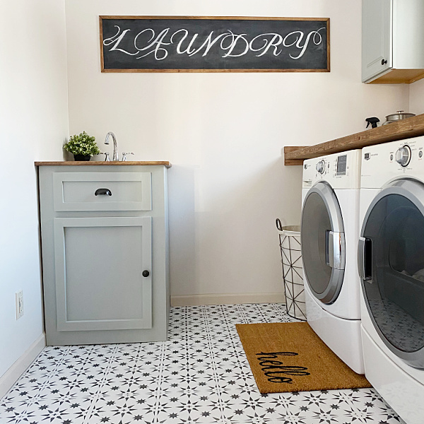 Framed Chalkboard Sign made from cardboard in this laundry room makeover