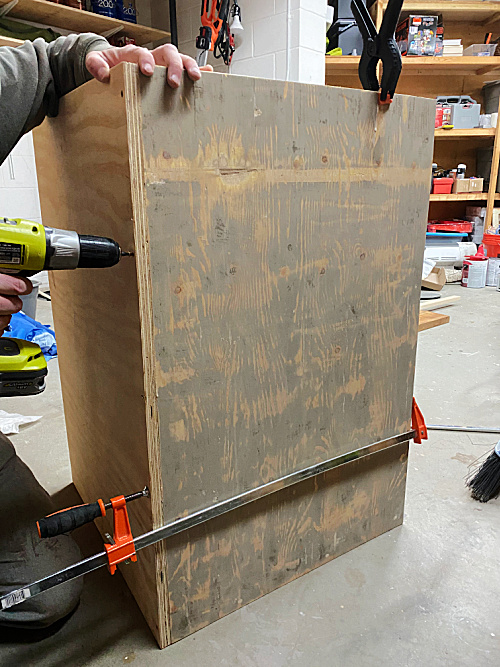 Assembling side and front of faux vanity which will hide a utility sink