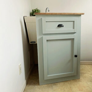Removable faux vanity created to hide a utility sink