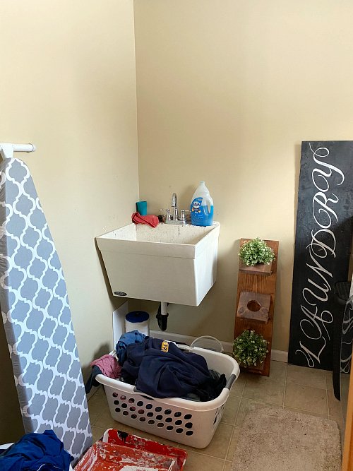 Laundry Room before makeover with view of the utility sink