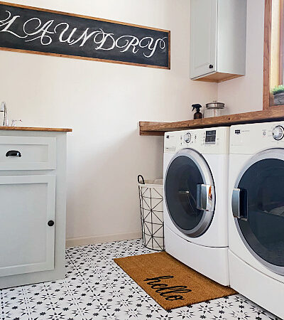 This laundry room got a major makeover for just $100. So many budget-friendly ideas in this space!