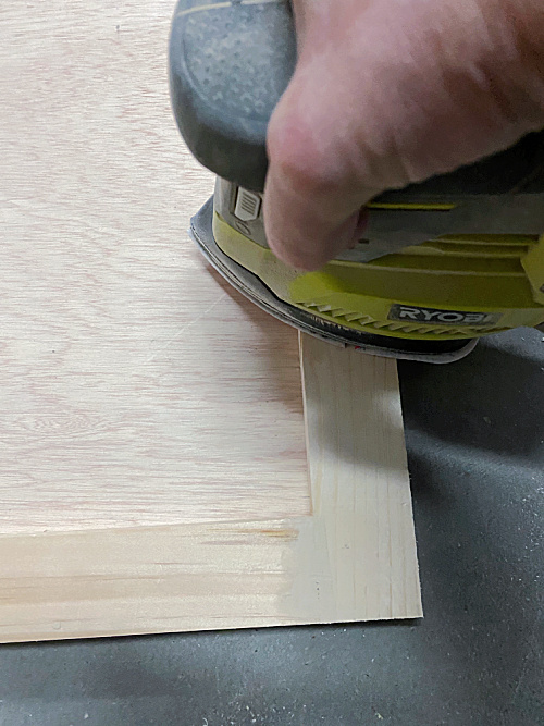 Sanding DIY Shaker Door prior to priming and painting.