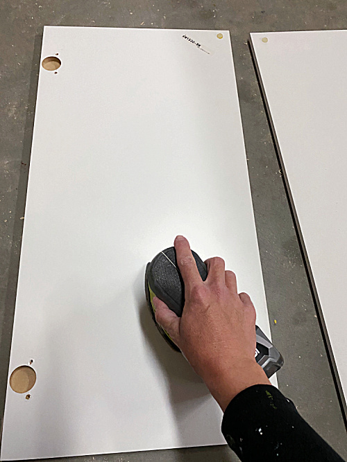 Use a mouse sander with a 120 grit sand paper to remove glossy sheen on laminate furniture prior to painting