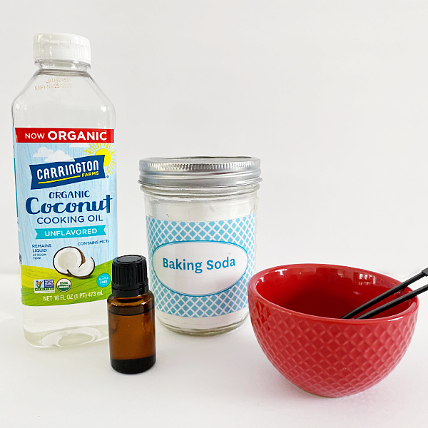 Ingredients needed to make your own homemade goo remover: coconut oil, baking soda, and citrus essential oil