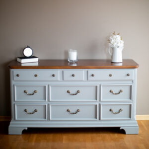 Nine drawer dresser with wood top, painted in the color Little Lamb by Fusion Mineral Paint. Antique Brass hardware.