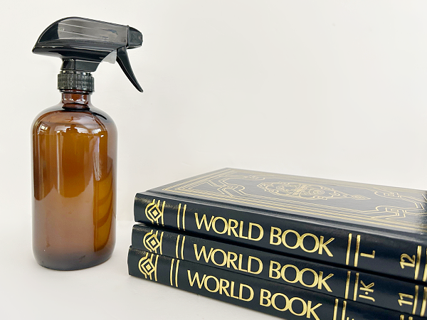 Items needed to fix curling rug corner: Spray bottle with water and heavy object