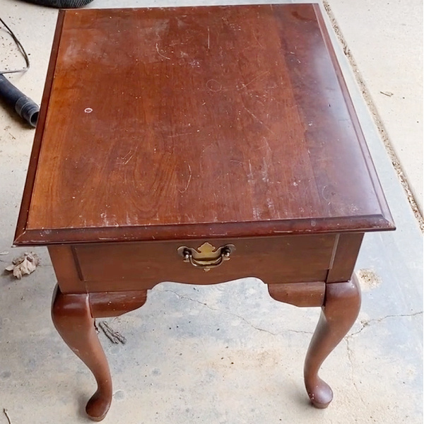 Old, outdated end table prior to using milk paint