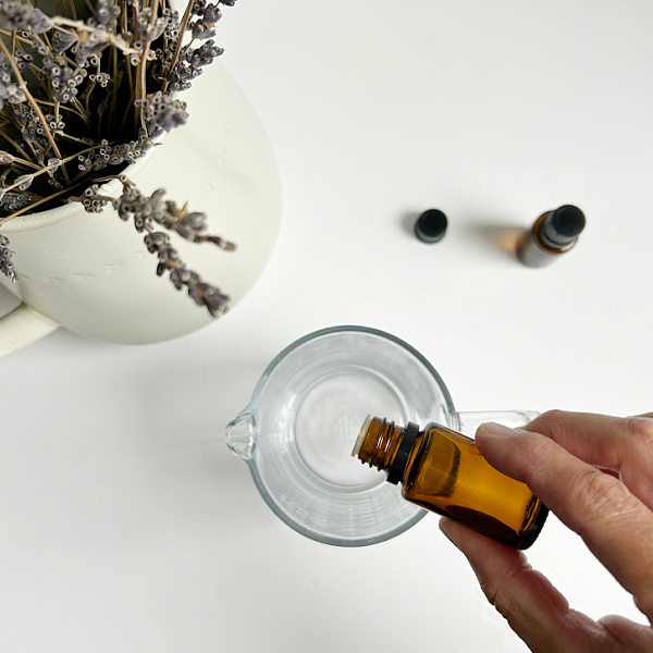 Adding essential oil to homemade room spray recipe