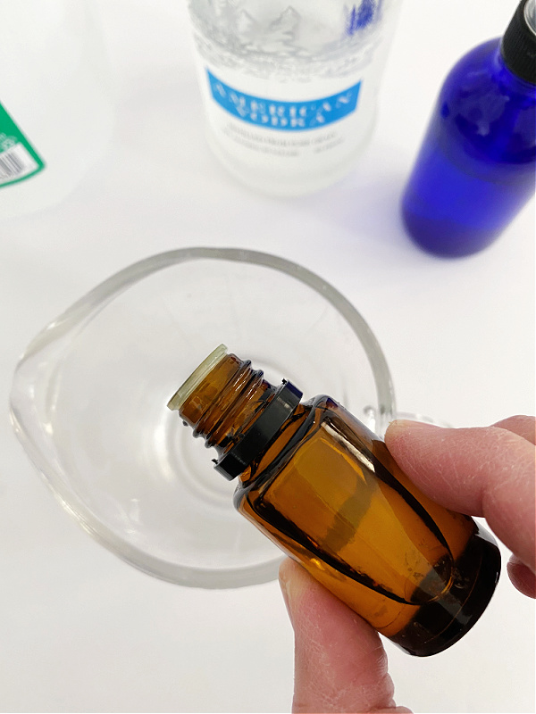 Adding essential oil to a homemade room spray