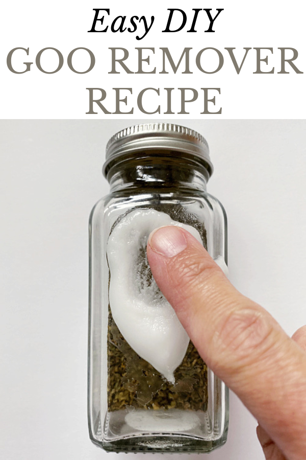 Applying DIY Goo Remover to Sticker residue on jar