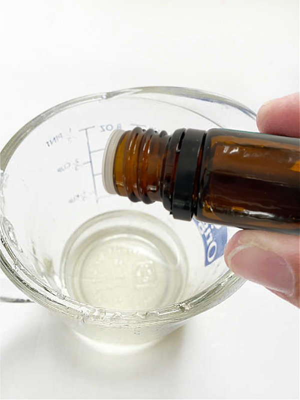 Adding Peppermint essential oil to a homemade lip balm recipe as it provides a little tingle, and soothes skin