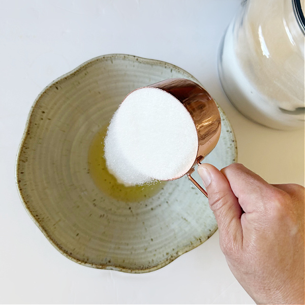 Adding sugar to lavender sugar scrub recipe