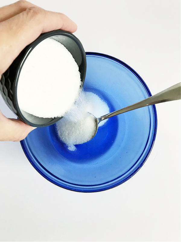 Adding sugar to DIY Lavender Sugar Scrub Recipe