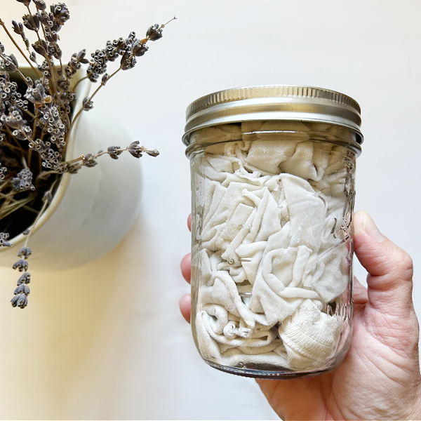 Glass jar full of DIY Cleaning Wipes