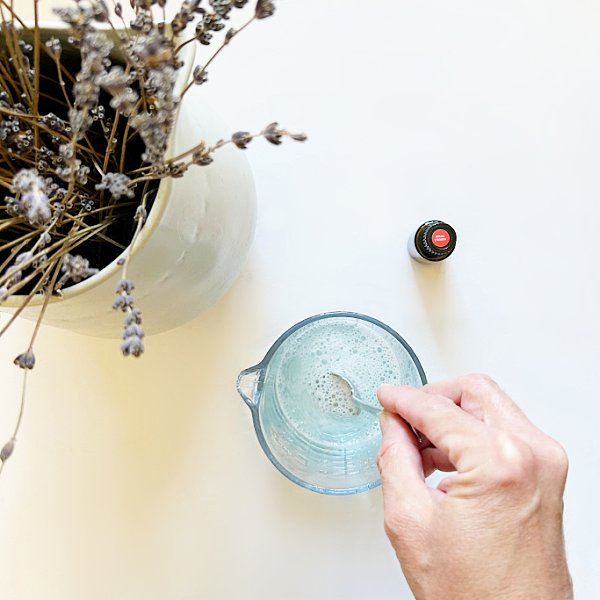 Stirring the solution to make homemade wipes