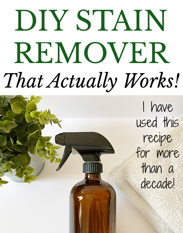 Amber Glass Bottle of DIY Stain Remover next to plant and stack of towels