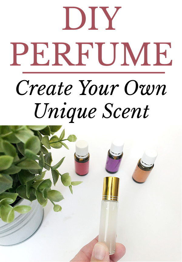 Holding a small spray bottle of DIY Perfume