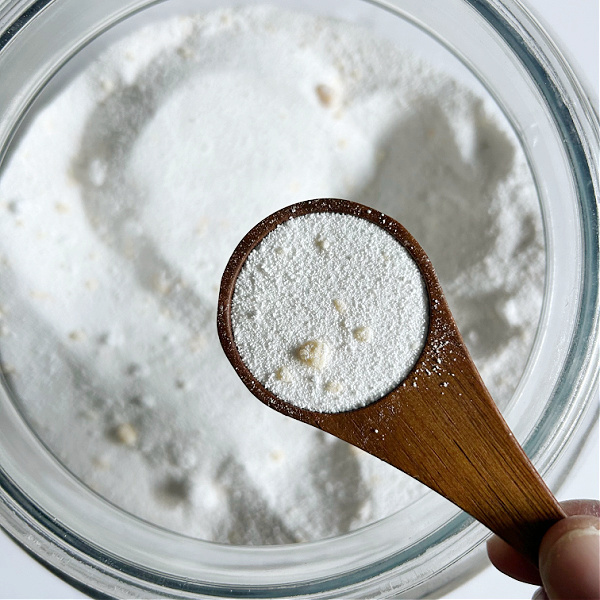 Homemade laundry soap in wooden scoop