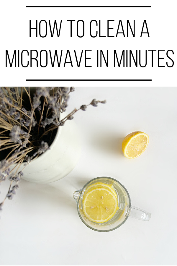 Lemon slices in glass liquid measuring cup filled with water and vinegar