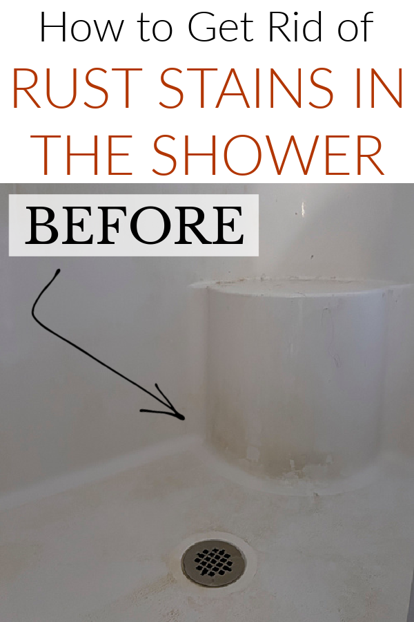 Shower stall showing rust stains prior to removing