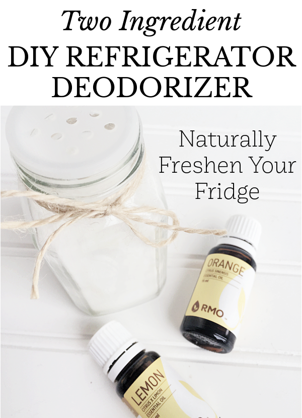 Homemade refrigerator deodorizer in spice jar next to two bottles of essential oil
