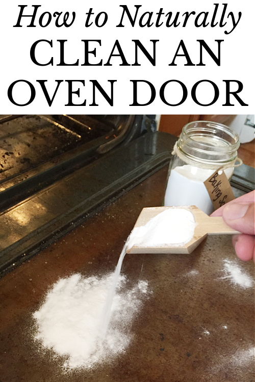 Scooping baking soda onto a dirty oven door