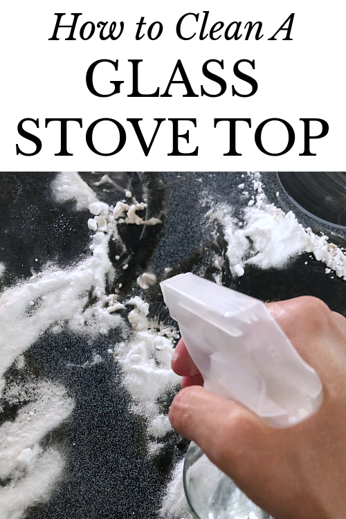 Spraying water on glass stove top to clean