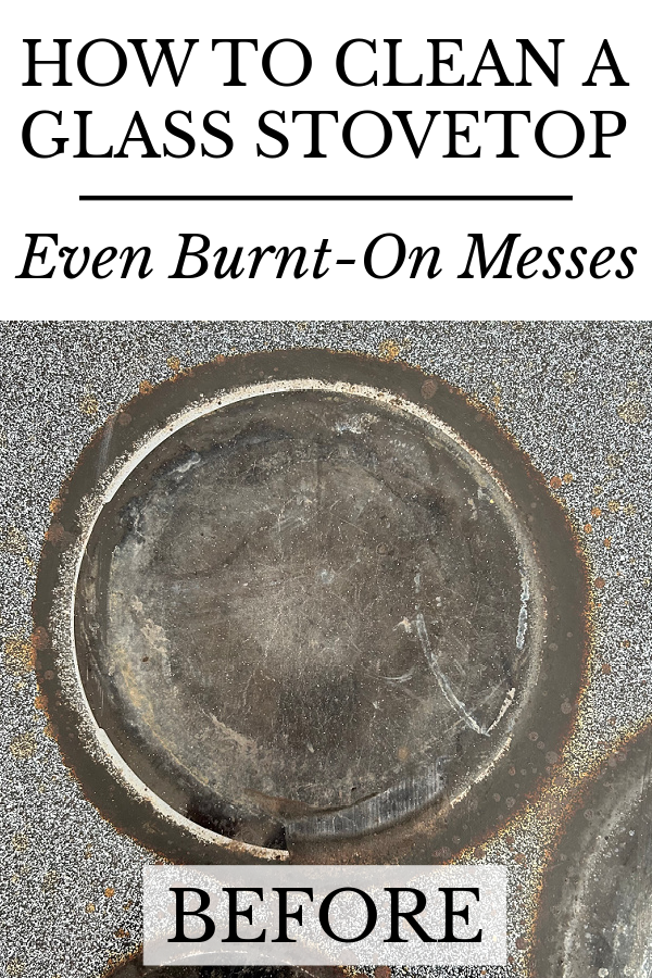 Burner on glass stovetop with large black rim of burnt on food
