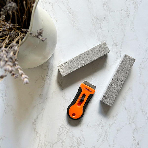 Two pumice stones and a razor