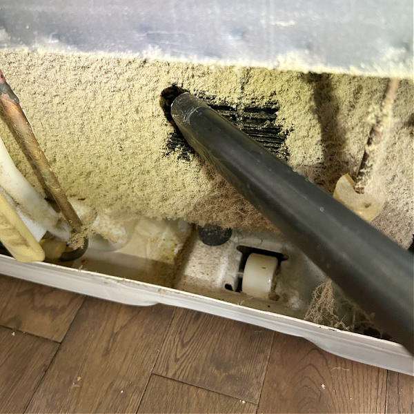 Vacuuming refrigerator coils