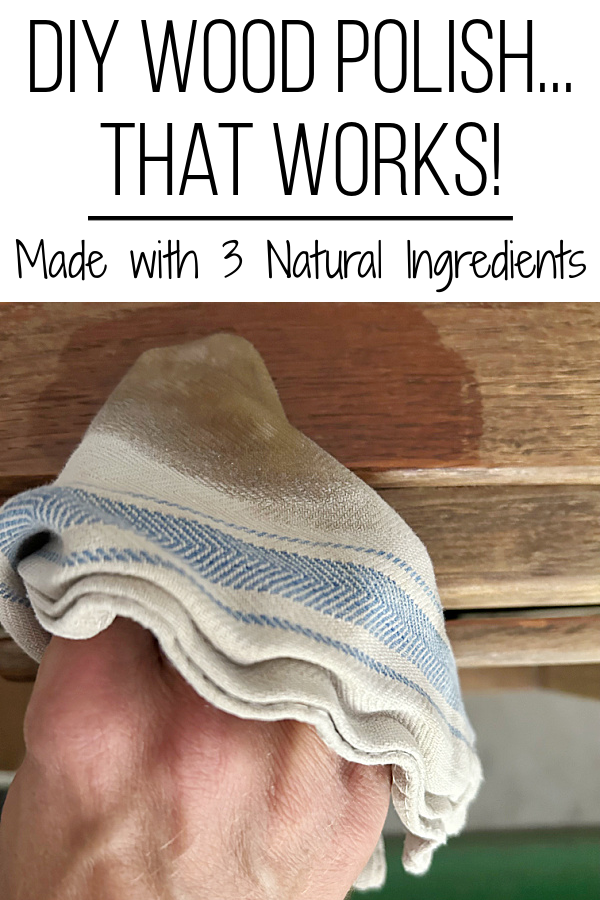Wiping DIY Furniture polish on a wood cabinet