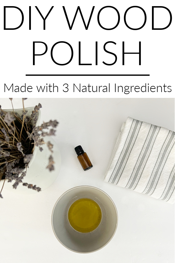 Ingredients needed to make DIY Furniture Polish: Bowl with vinegar and jojoba oil with a bottle of essential oil