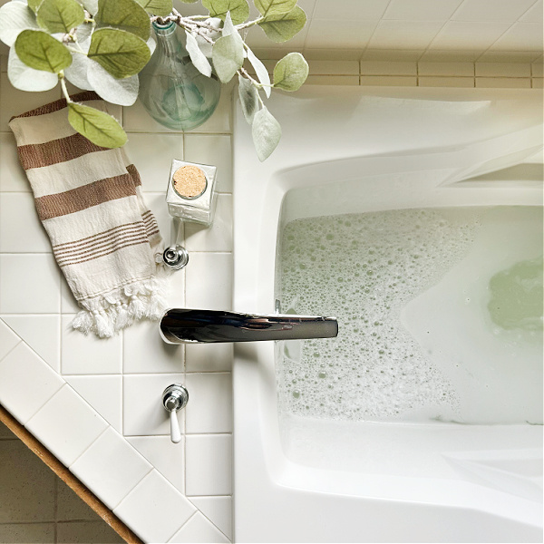 Filling bath while adding homemade milk bath powder