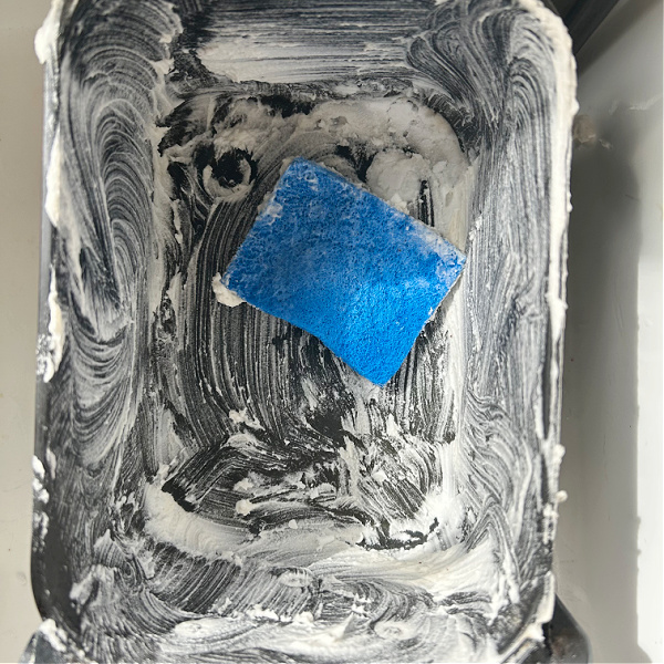 Cleaning air fryer basket with a paste of baking soda and dish soap