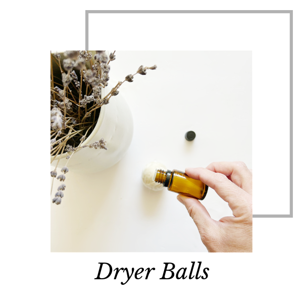 Adding a couple drops of essential oil to homemade dryer balls
