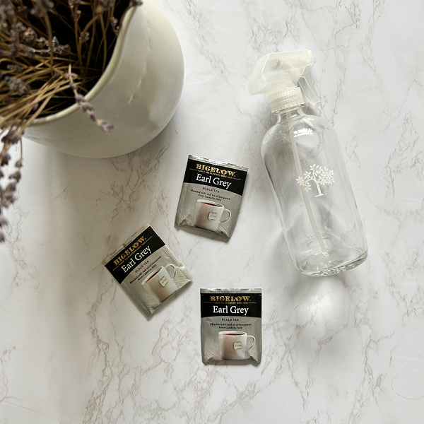 3 bags of black tea and a glass spray bottle